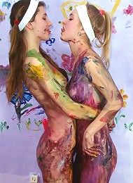 Teenage cuties playing with paint